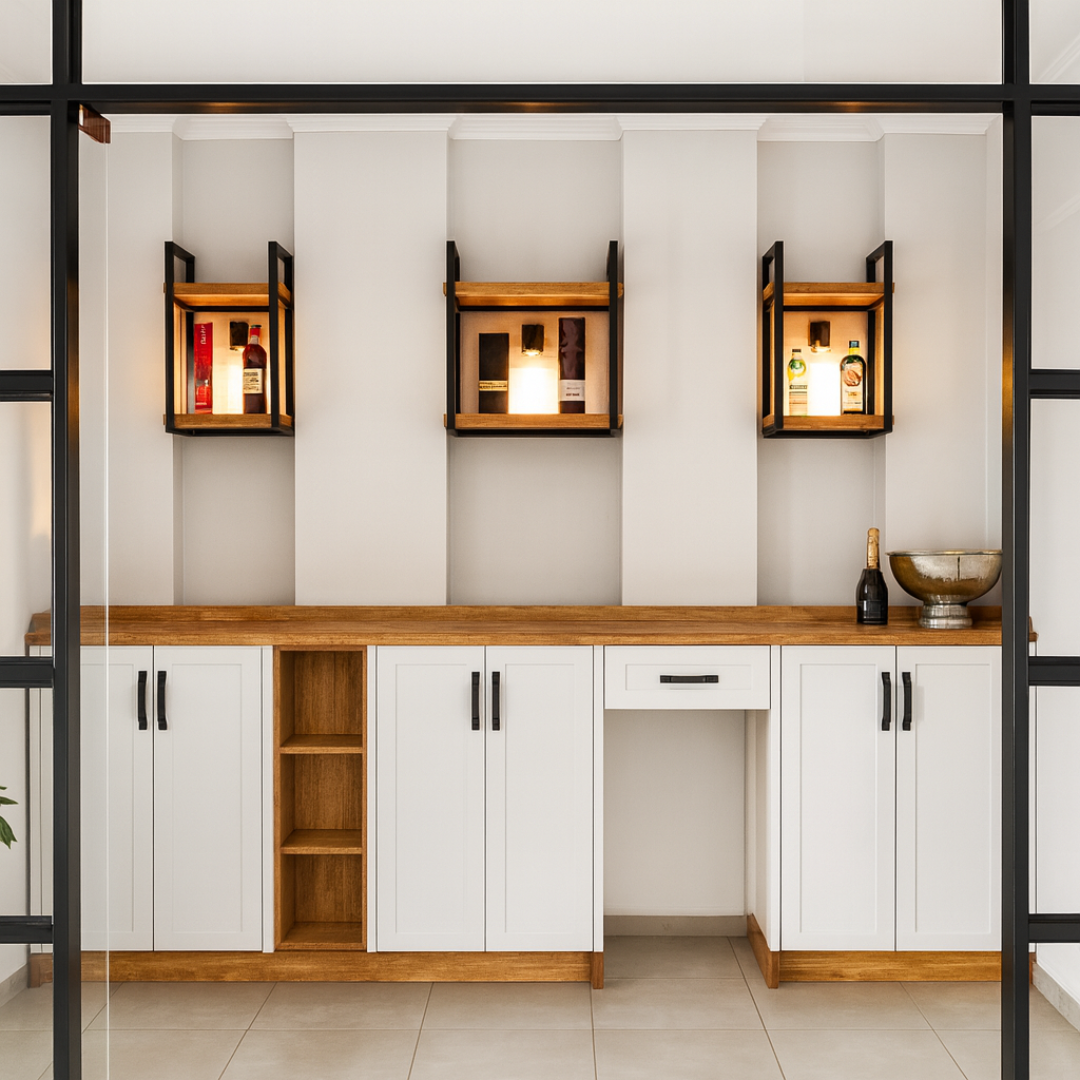 Modern home bar area with white cabinets, wood countertop, and black-framed glass doors.