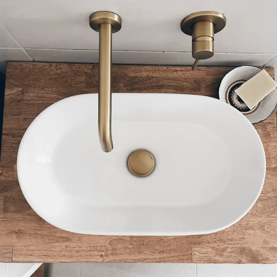 Round bathroom sink with brass handles