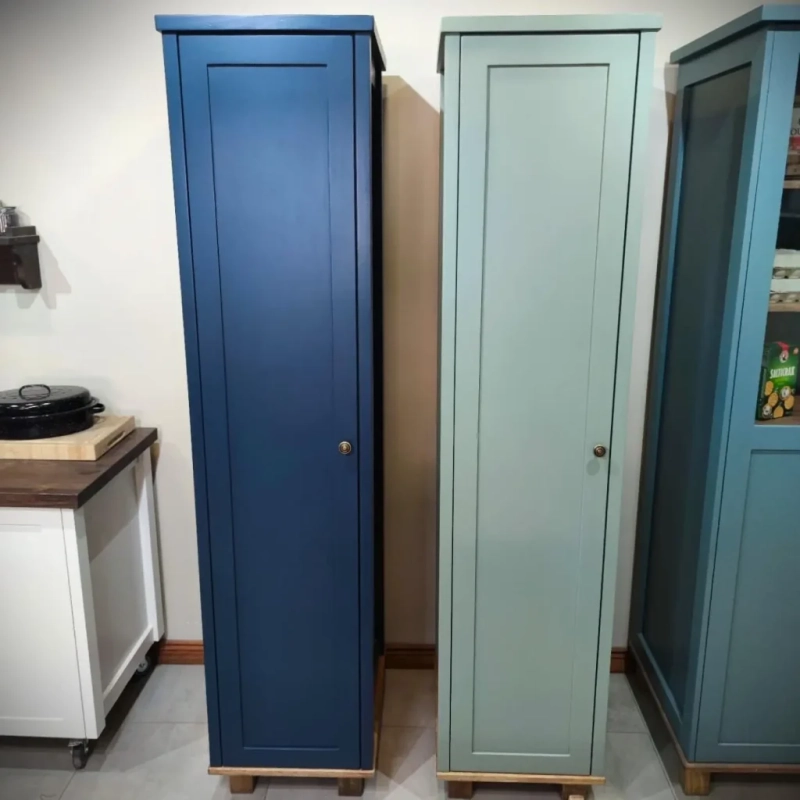 A blue and a green broom cabinet