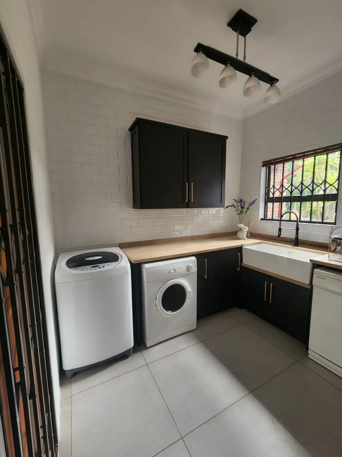 Butler Sink Laundry Room A laundry room with a black butler sink unit