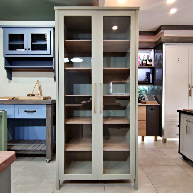 DIsplay Cabinet Green A green display cabinet with shelving and glass doors in a kitchen