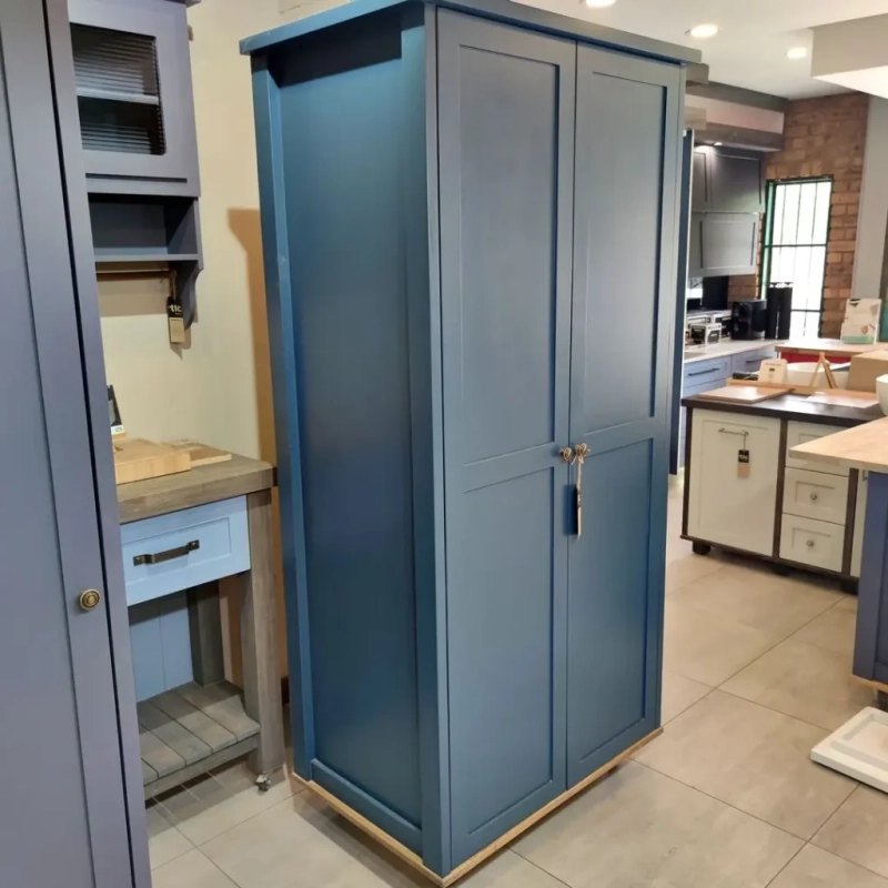 Deluxe Pantry Blue Left A blue deluxe pantry in a kitchen