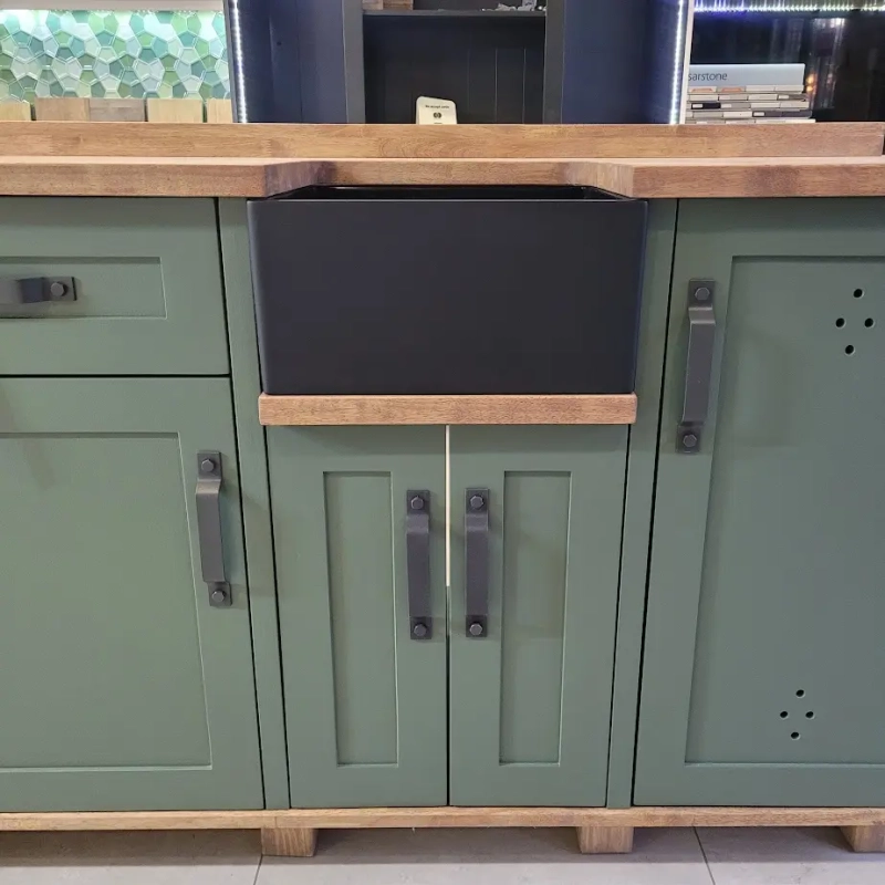 Green Baby Butler Sink Black Standard Sink Kitchen A Green Baby Butler Sink Cabinet With A Black Standard Sink In A Kitchen