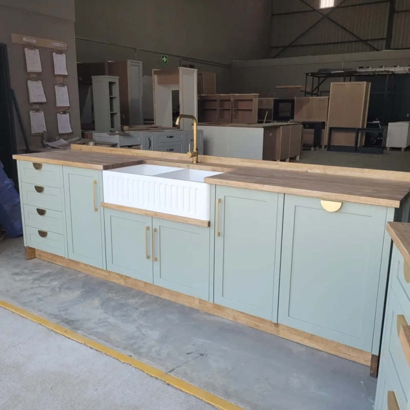 Green Double Belfast Butler Sink Warehouse Right A Right View Of A Green Double Belfast Butler Sink Cabinet In A Warehouse