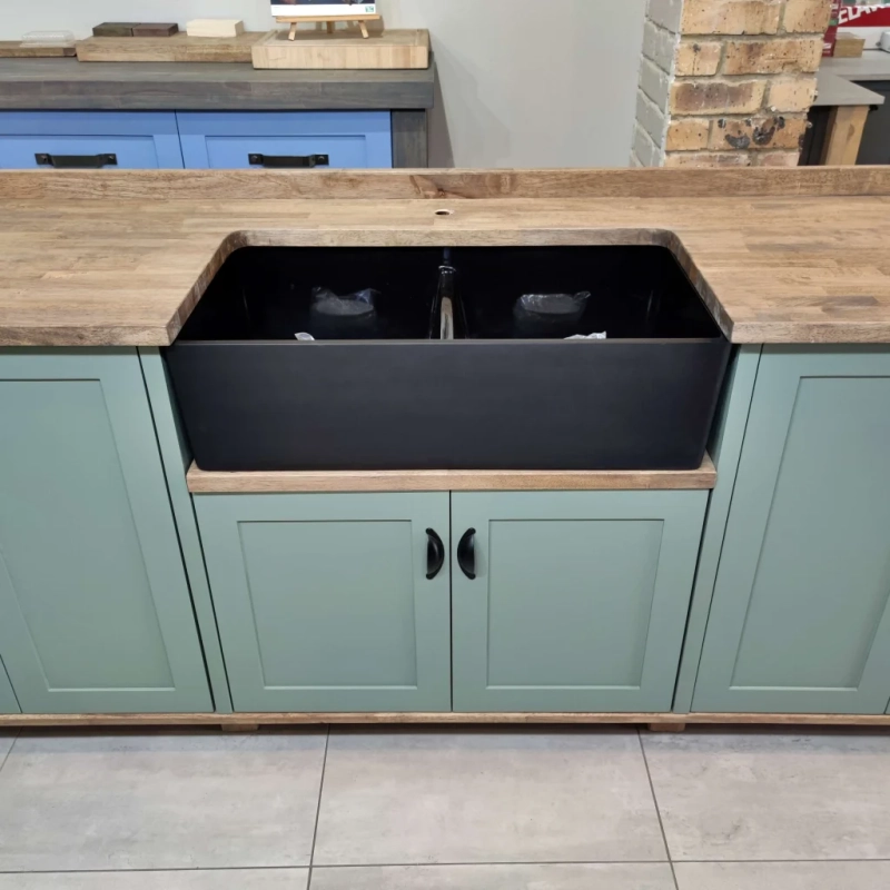 Green Double Butler Sink Showroom Top A Front View Closeup Of A Green Double Butler Sink Cabinet In A Showroom