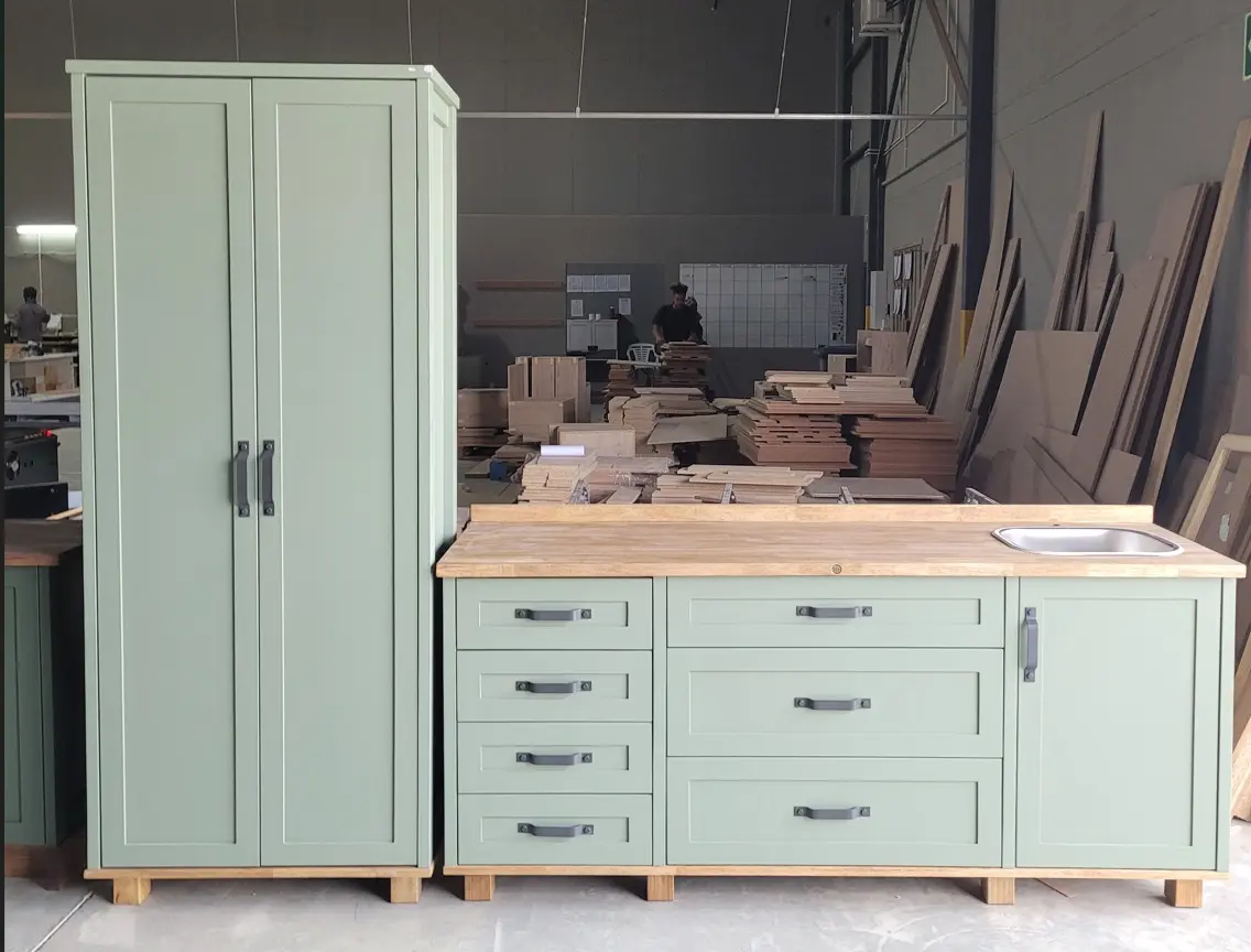 Green Full Kitchen Set A green full kitchen set with drawers, a pantry cabinet and a sink