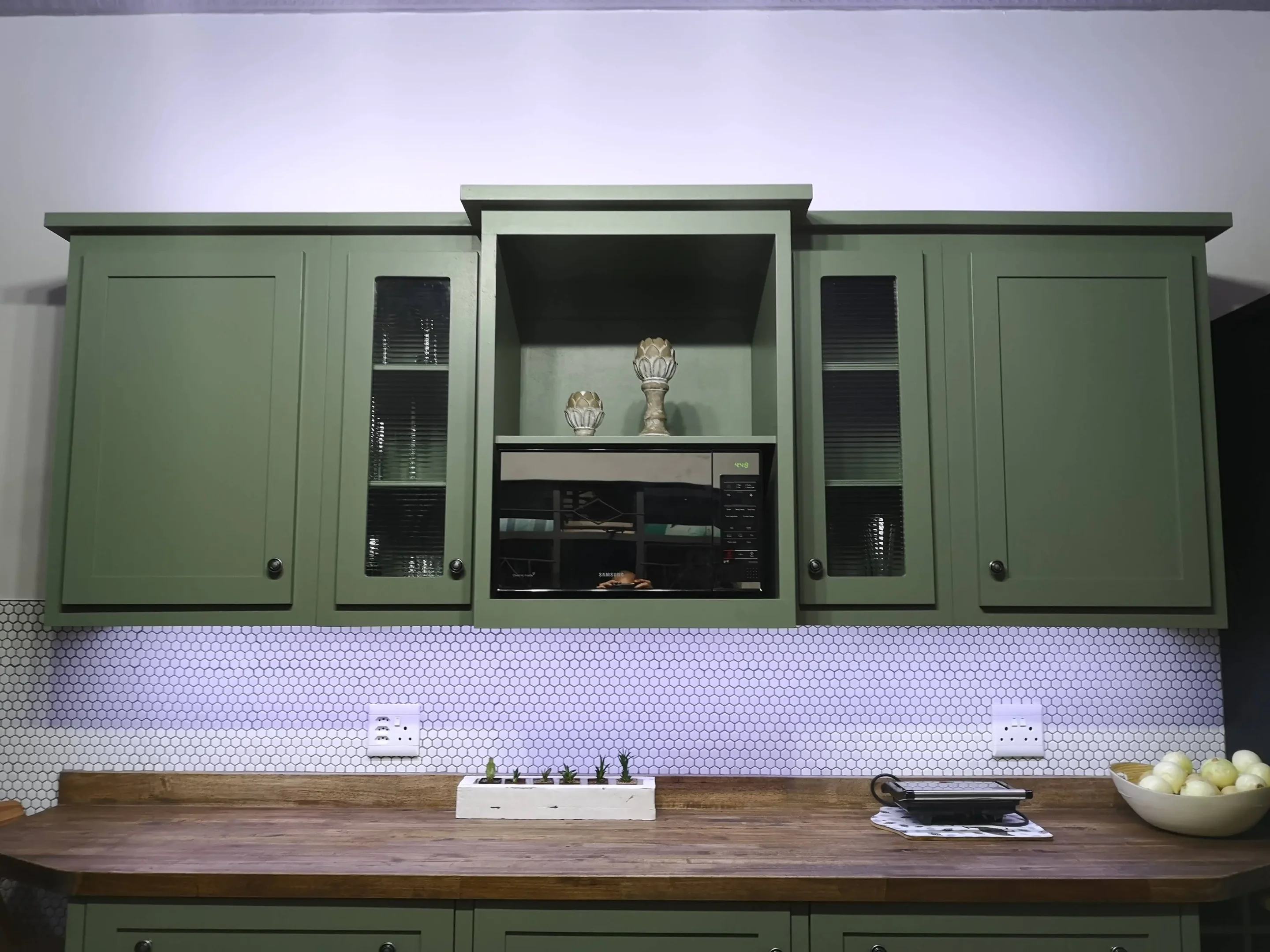 Green Microwave Cabinet Custom Kitchen A Custom Wall Cabinet Unit With Four Single Door Cabinets On The Sides And A Microwave Cabinet In the Center