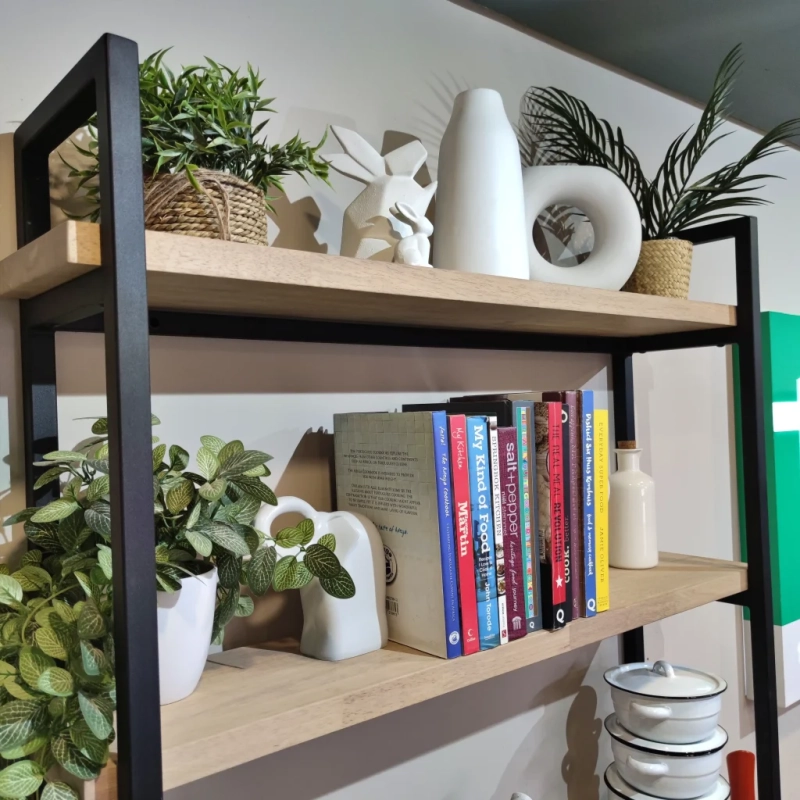 Left Three Tier Metalica Shelf In Showroom A Left View Closeup Of A Three Tier Metalica Shelf With Books And Plants In A Showroom