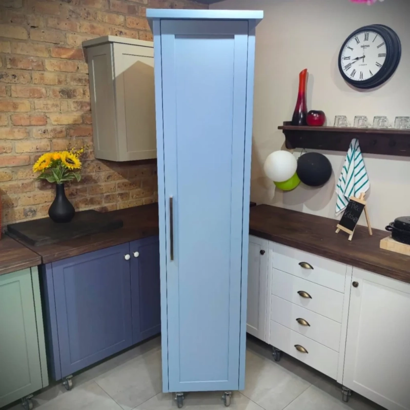 Single Door Pantry Blue A blue single door pantry in a kitchen