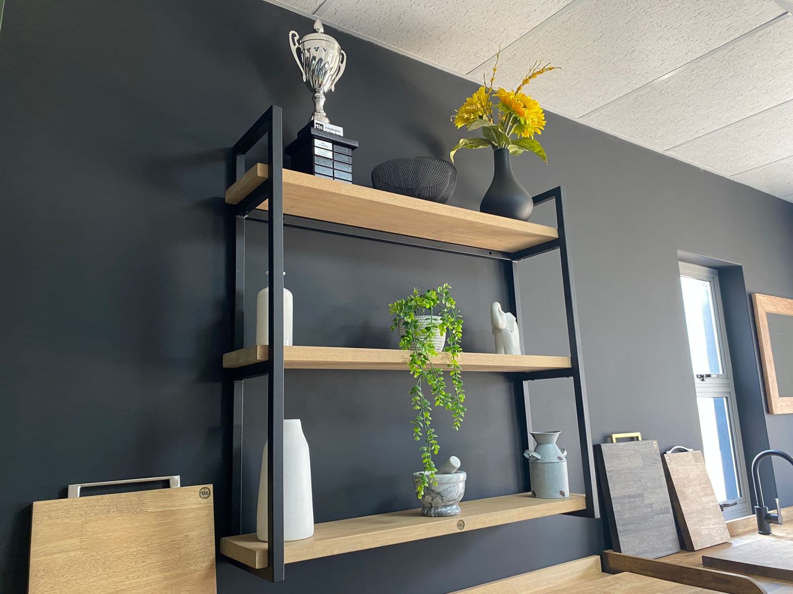 Three Tier Metalica Shelf Showroom A Three Tier Metalica Shelf Holding A Vase, Trophy and various other Ornaments in a Showroom