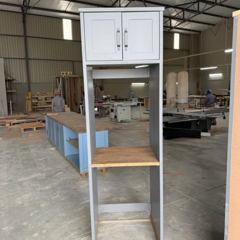 A Front View Of A Blue Washing Machine House Cabinet In A Warehouse