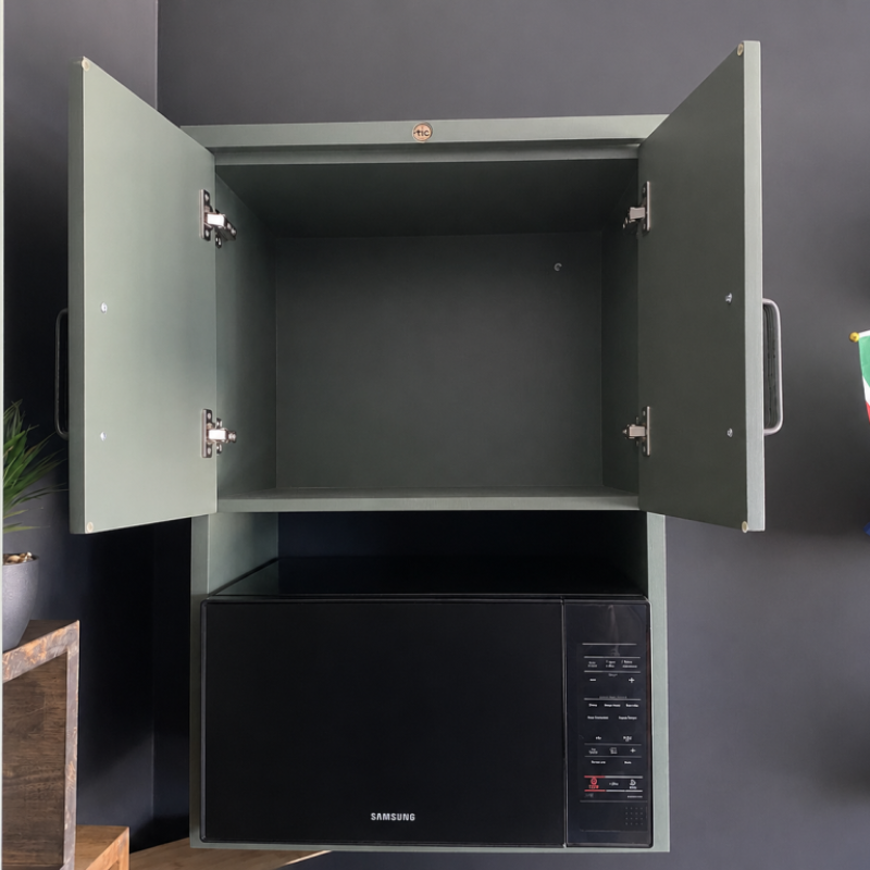 Open Green Microwave Wall Cabinet Showroom Front A Front View of An Open Green Microwave Wall Cabinet In A Showroom