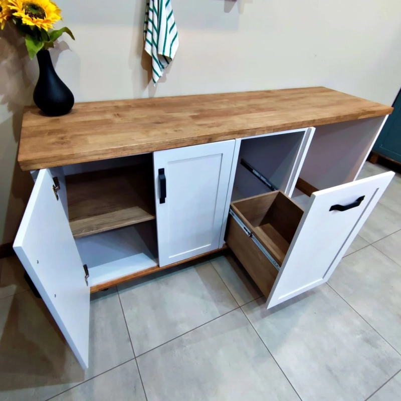 A Front View Of An Open White Appliance Panel Cabinet In a Home