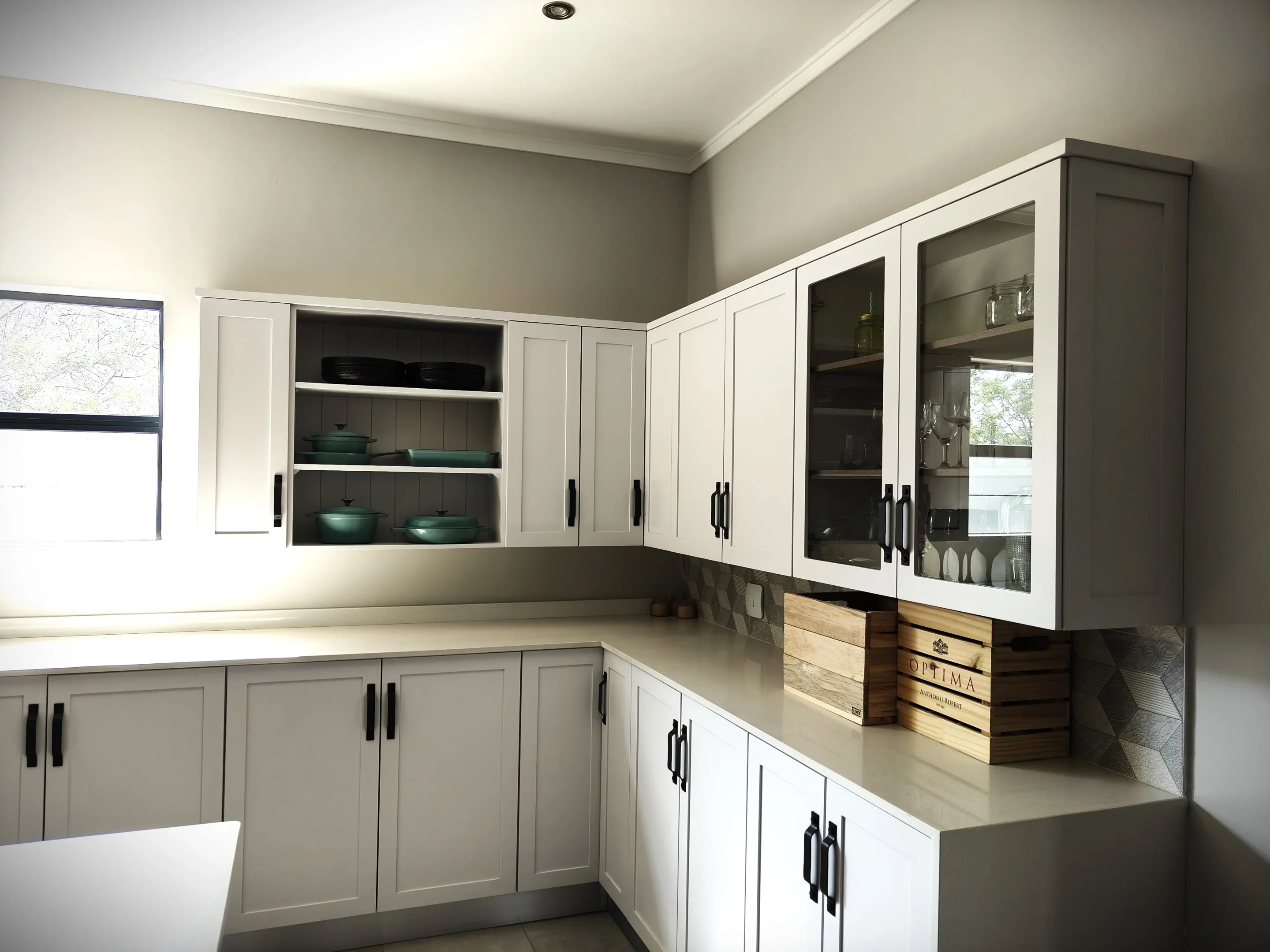 White Wall Cabinet Kitchen Assorted Various Single Door, Double Door and Open Shelf White Wall Cabinets In a Kitchen